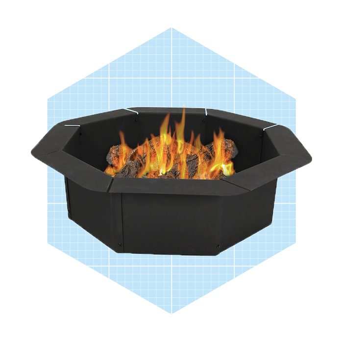 An octagonal fire pit contains burning logs, producing flames. It is set against a light blue, grid-patterned background.