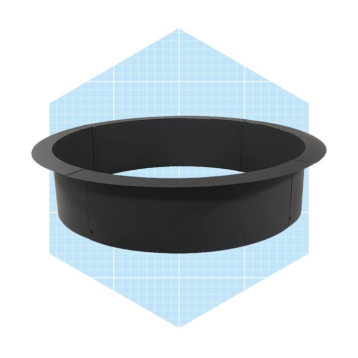 A circular black metal ring stands upright against a light blue geometric background, suggesting use in construction or landscaping.