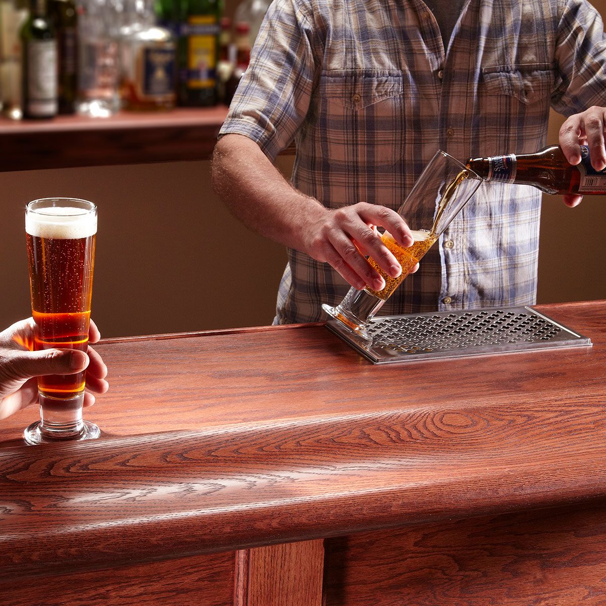 Someone pouring beer in a glass
